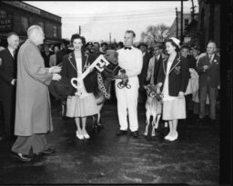 Item is a photo of the Kingston Fall Fair Dairy Princesses with a calf.